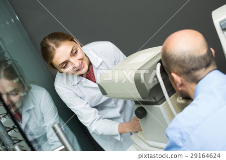 Eye examination at clinic. Eye examination at clinic. 29164624