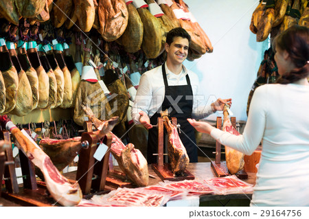 Female customer buying Spanish jamon 29164756