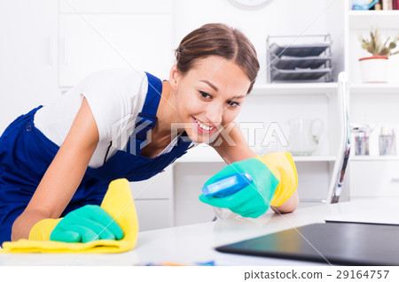 woman cleaning in company office woman cleaning in company office 29164757