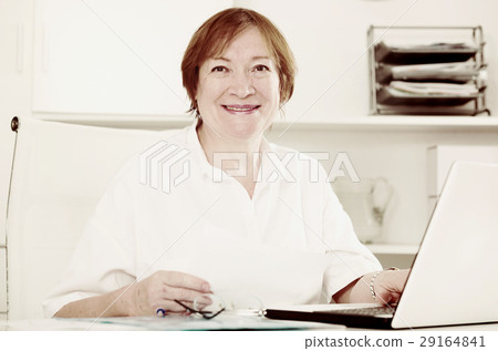 Woman working productively Woman working productively 29164841