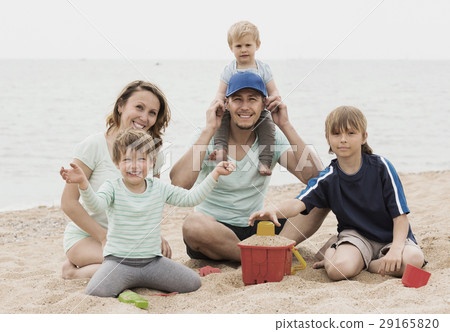 Happy family of five at sea shore Happy family of five at sea shore 29165820