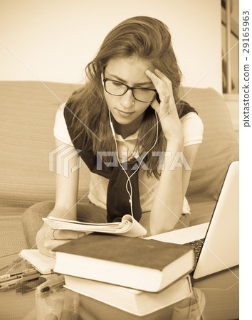 Teenager doing homework Teenager doing homework 29165963