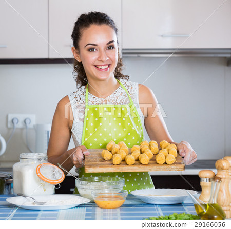 housewife cooking breadcrumbed croquettes housewife cooking breadcrumbed croquettes 29166056