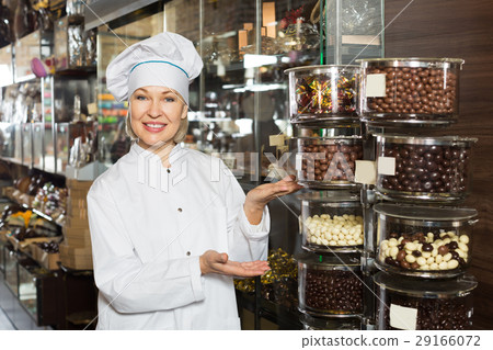 Smiling woman selling chocolates Smiling woman selling chocolates 29166072