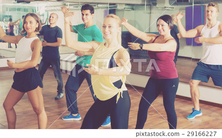Men and ladies dancing zumba 29166227