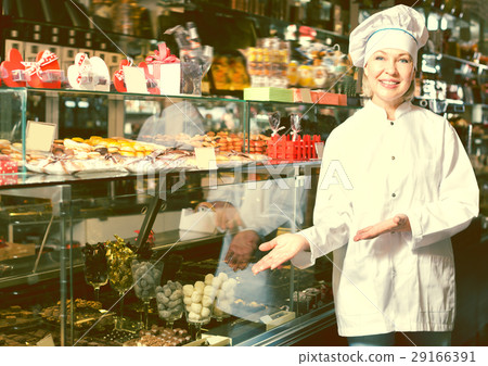 Happy woman selling chocolates 29166391