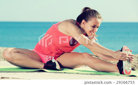 Young sporty woman exercising Young sporty woman exercising 29166755