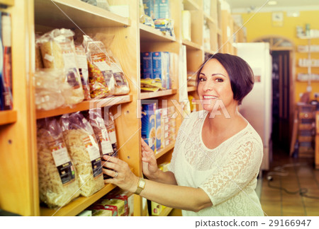 Mature woman customer holding with cereal products Mature woman customer holding with cereal products 29166947