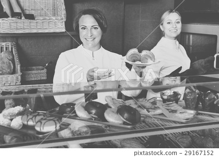 Female cooks demonstrating and selling pastry in the cafe Female cooks demonstrating and selling pastry in the cafe 29167152