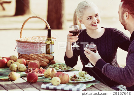 Loving beautiful happy couple drinking wine Loving beautiful happy couple drinking wine 29167648