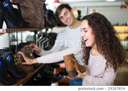 Young couple in a shoe store. 29167654