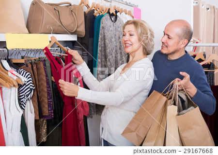 Happy couple buying new fancy dress 29167668