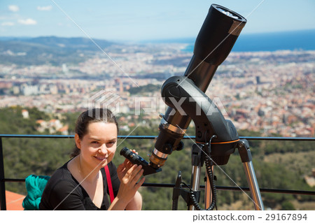 woman looking in telescope 29167894