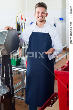 Male employee packing wine bottles at sparkling wine factory 29168049