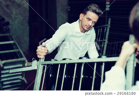 Male worker transporting wine bottles to storage Male worker transporting wine bottles to storage 29168180