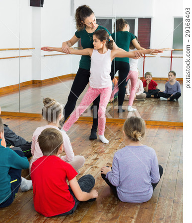 Young ballet dancers exercising in ballroom 29168403
