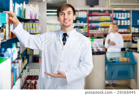 Portrait of two pharmacists working in modern farmacy Portrait of two pharmacists working in modern farmacy 29168445