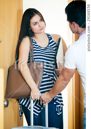 Stressed husband trying to stop girl 29168556