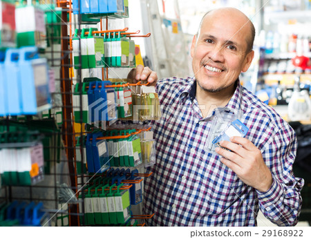 man choosing nails and screws 29168922