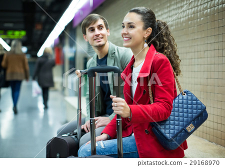 couple sitting at platform couple sitting at platform 29168970