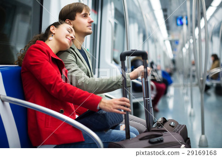 Couple with baggage in car Couple with baggage in car 29169168