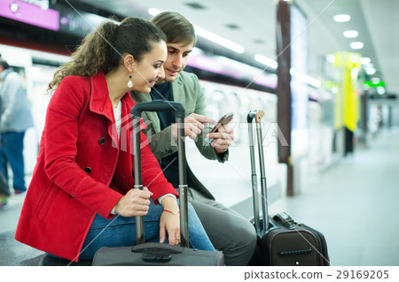 couple sitting at platform couple sitting at platform 29169205