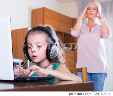 daughter using laptop instead of studying daughter using laptop instead of studying 29169527