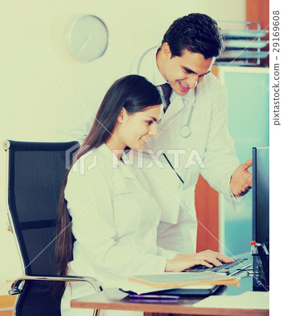 Two professional doctors brainstorming and sharing information 29169608