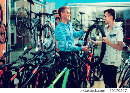 Father and son choosing wheel 29170227