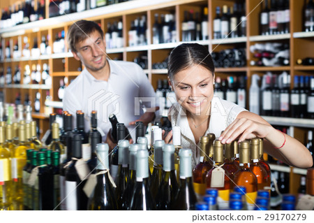 Young couple choosing together wine 29170279