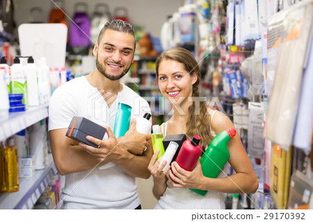 Couple with shampoo in the store. Couple with shampoo in the store. 29170392