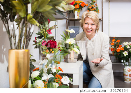 Laughing female customer choosing flowers 29170564