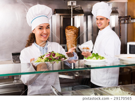 Staff posing at kebab counter 29170565