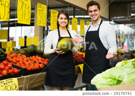 Sellers at vegetables market. 29170741