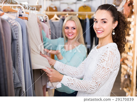 Two girls at clothing store 29170839