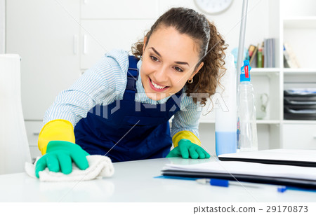 Woman with supplies cleaning in office 29170873