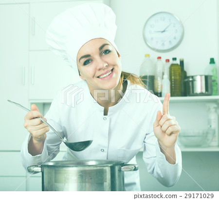 Female cook tasting food Female cook tasting food 29171029