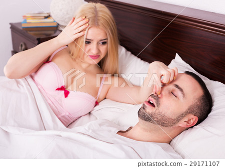 Unsleeping woman and snoring man 29171107