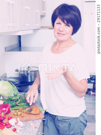 mature woman making salad mature woman making salad 29171133