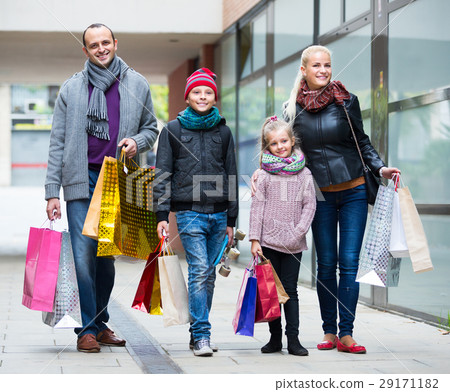 Family couple with kids on city street 29171182