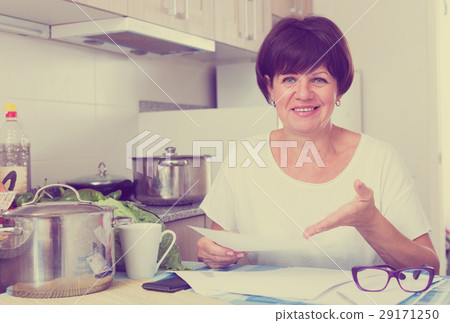 cheerful woman paying bills 29171250