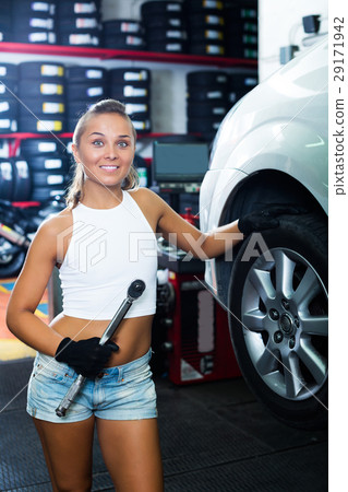 Mechanic working on car whee 29171942