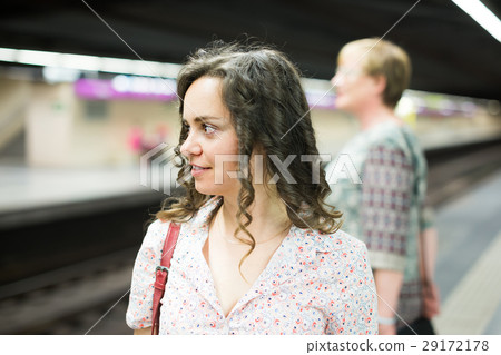 Adult female passenger riding underground 29172178