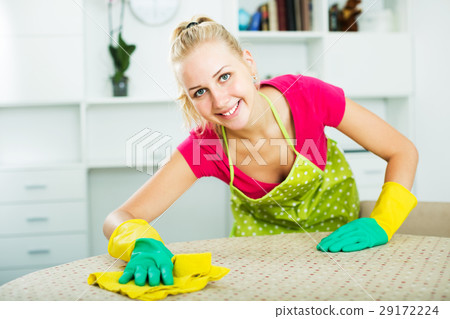 Woman wiping surfaces indoors 29172224