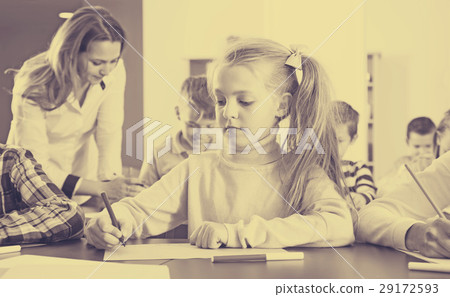 cheerful little kids with teacher drawing in classroom 29172593