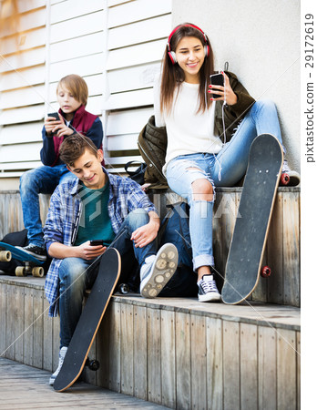 Teenagers with mobile phones Teenagers with mobile phones 29172619