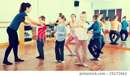 Young ballet dancers exercising in ballroom 29172662