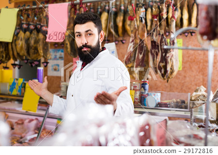 assistant demonstrating sorts of meat assistant demonstrating sorts of meat 29172816