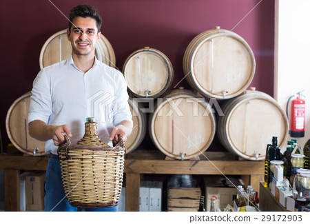 man holding large wine bottle 29172903