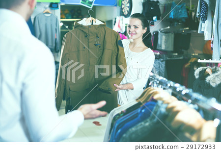 Couple choosing new coat 29172933